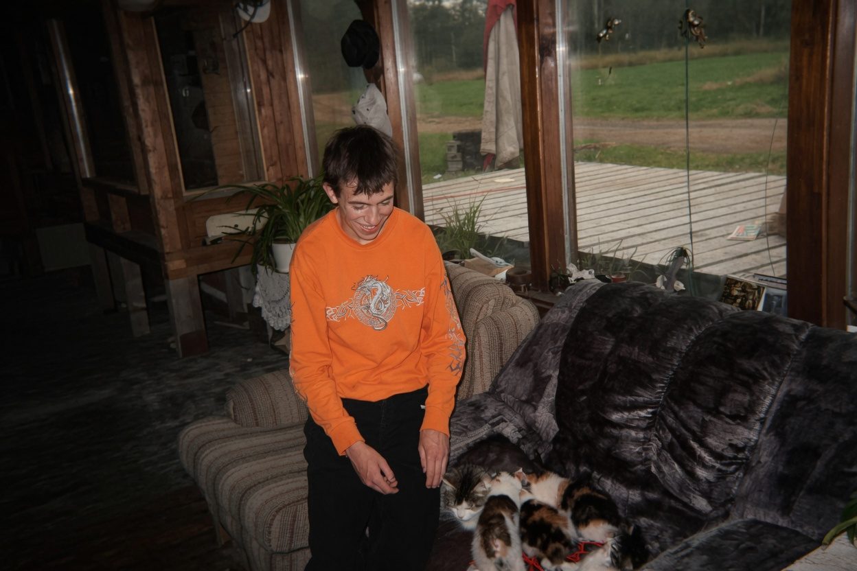 Thomas holding a litter of kittens at Little Smokey