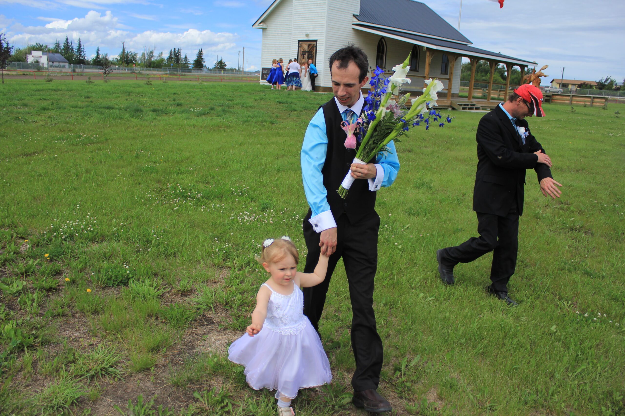 Thomas Cheesman with his child in a field
